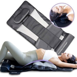 A woman stretching on a Baloom home massager